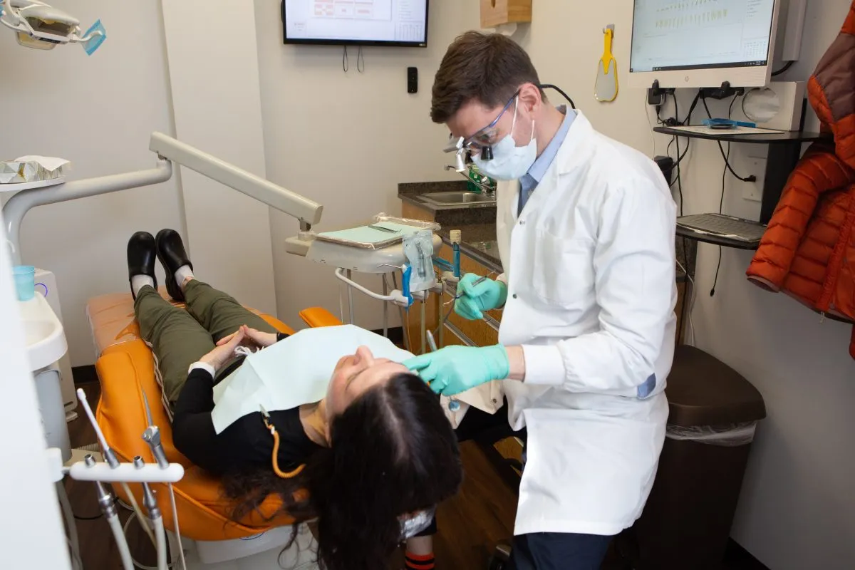 Dentist examining a patient in a Dental Korner treatment room