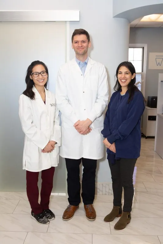 Dr. Kroner with two of the Dental Korner dentists in the office