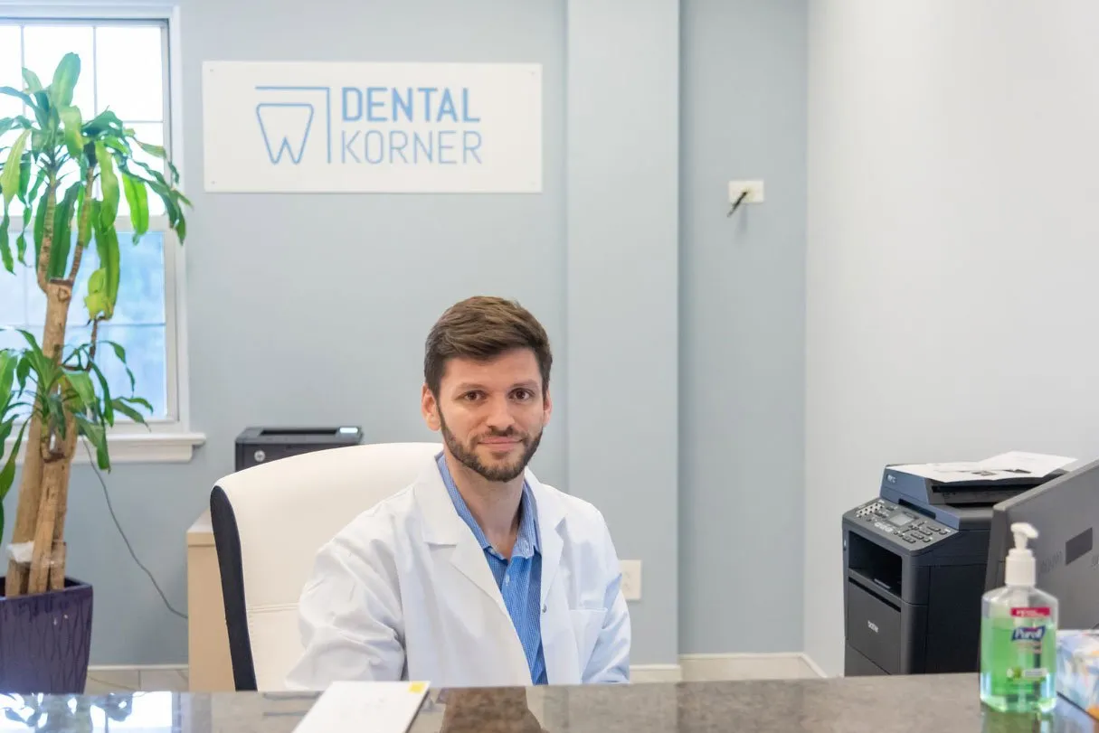 Dr. Kroner at his desk in the Dental Korner office in Great Neck